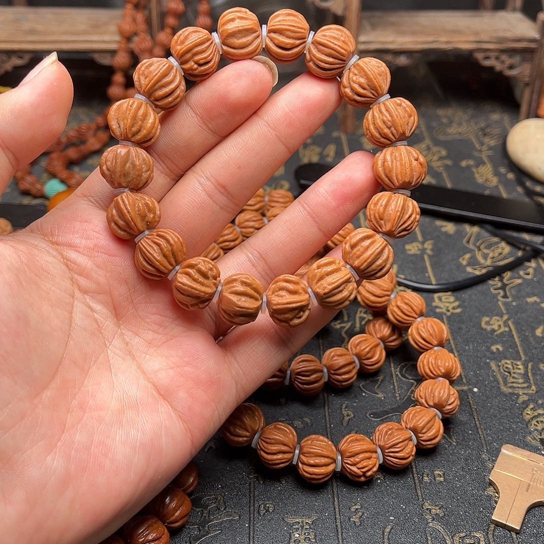 桃核吊坠佛手手串