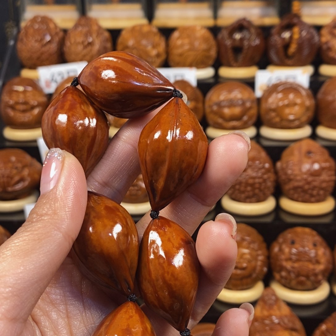 橄榄核吊坠小*手持一条0066666