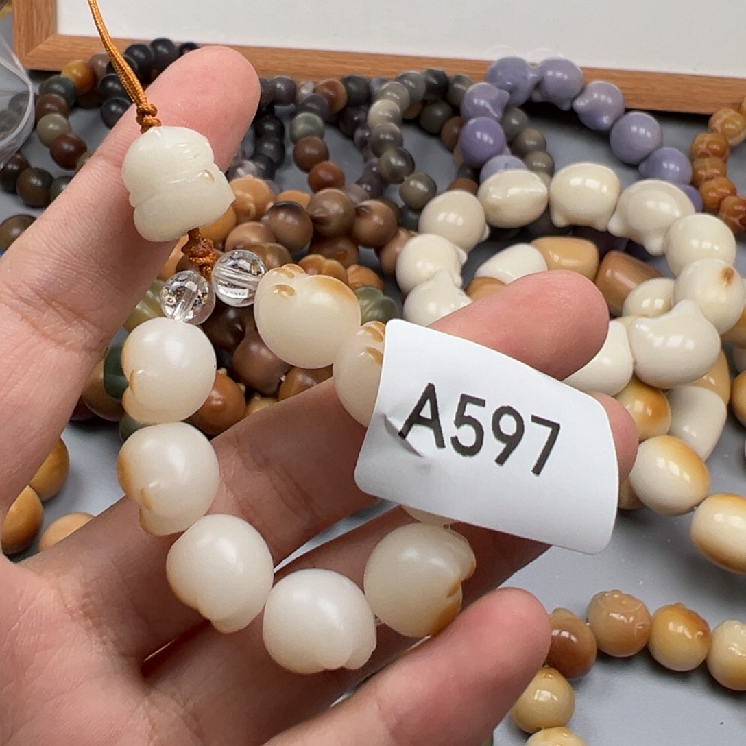 夕***笙吊坠菩提根/象牙果A597猫爪12mm通货一串