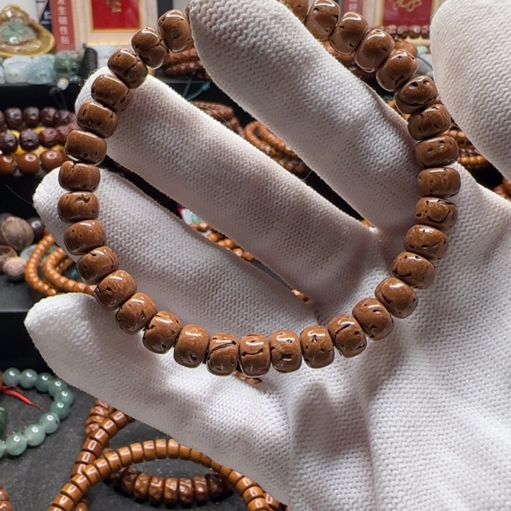 紫金鼠手串8*5.6桃核短轴手串