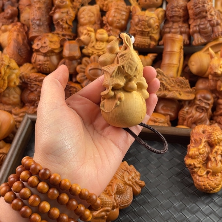 崖柏一物一拍手把件