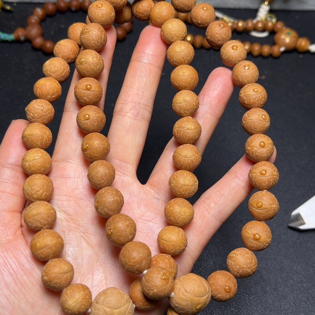 凤眼菩提吊坠12.5mm27颗精品手持