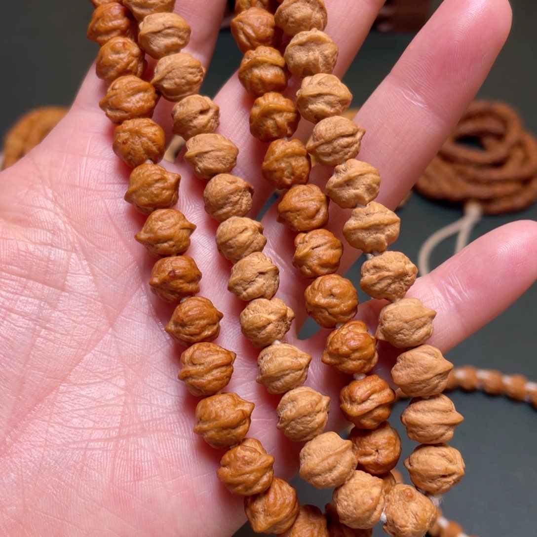 柏香籽/百香籽吊坠白牙手持横打 