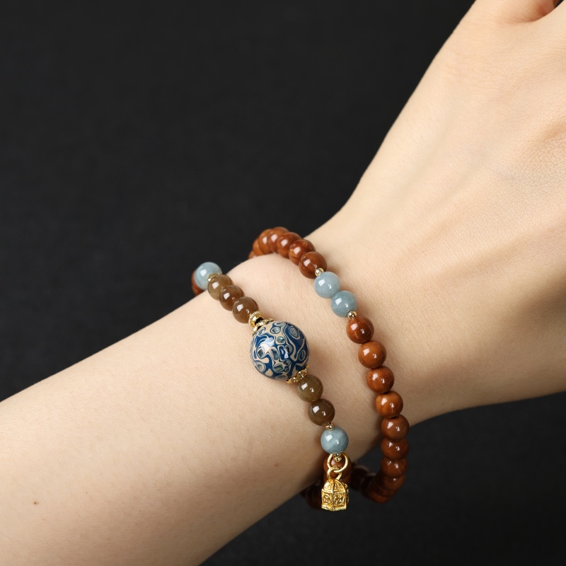 0.6A级库克带漆珠带配珠精美双圈手串MK918