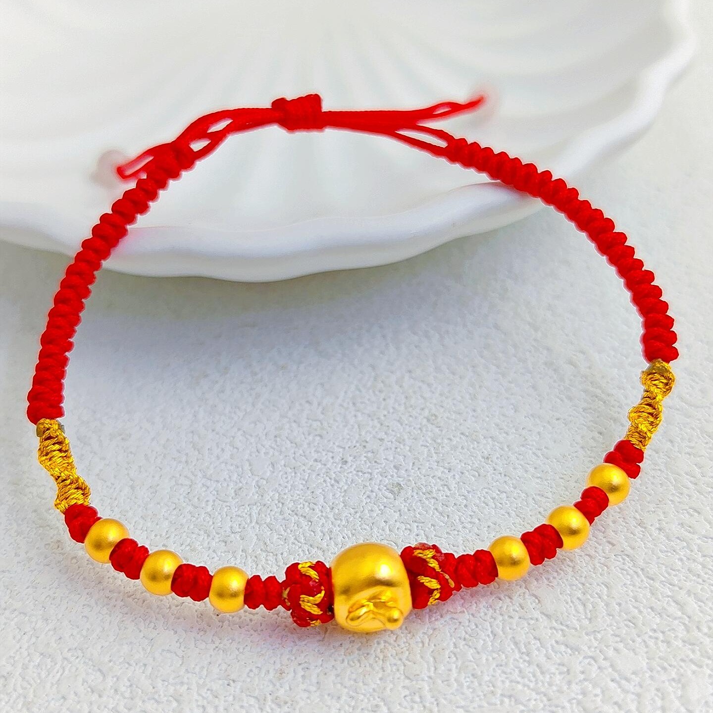 周大金足金苹果金珠编织链