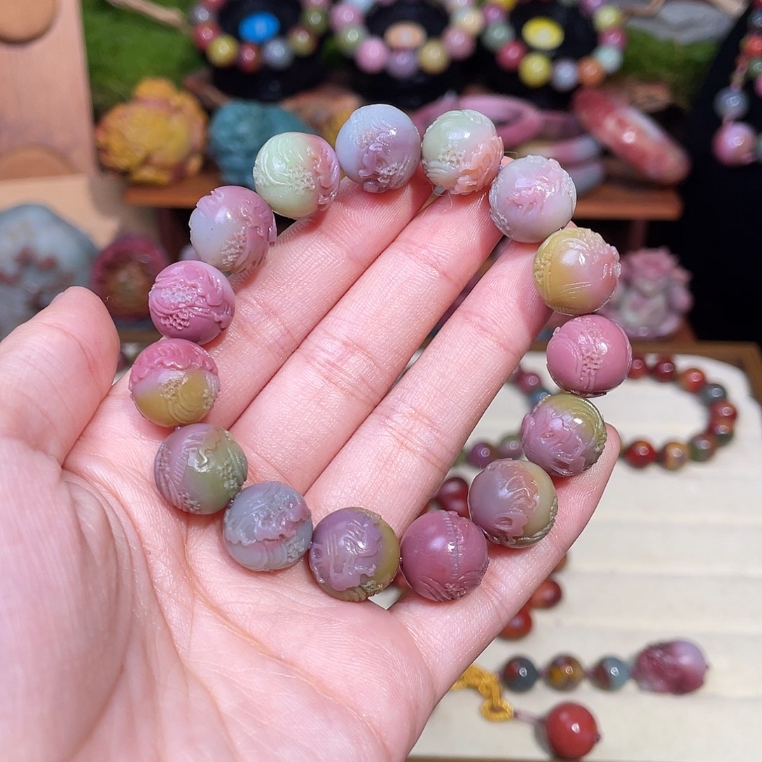 苏***么玛瑙/玉髓未镶嵌手串盐源玛瑙仙色系炫彩彩虹骆驼手串