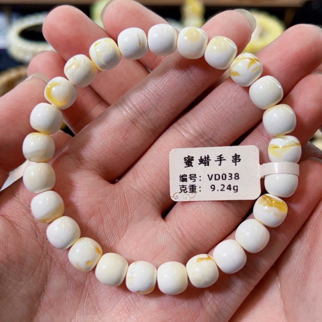 未镶嵌琥珀裸石8.5mm金漆白溶洞老型手串