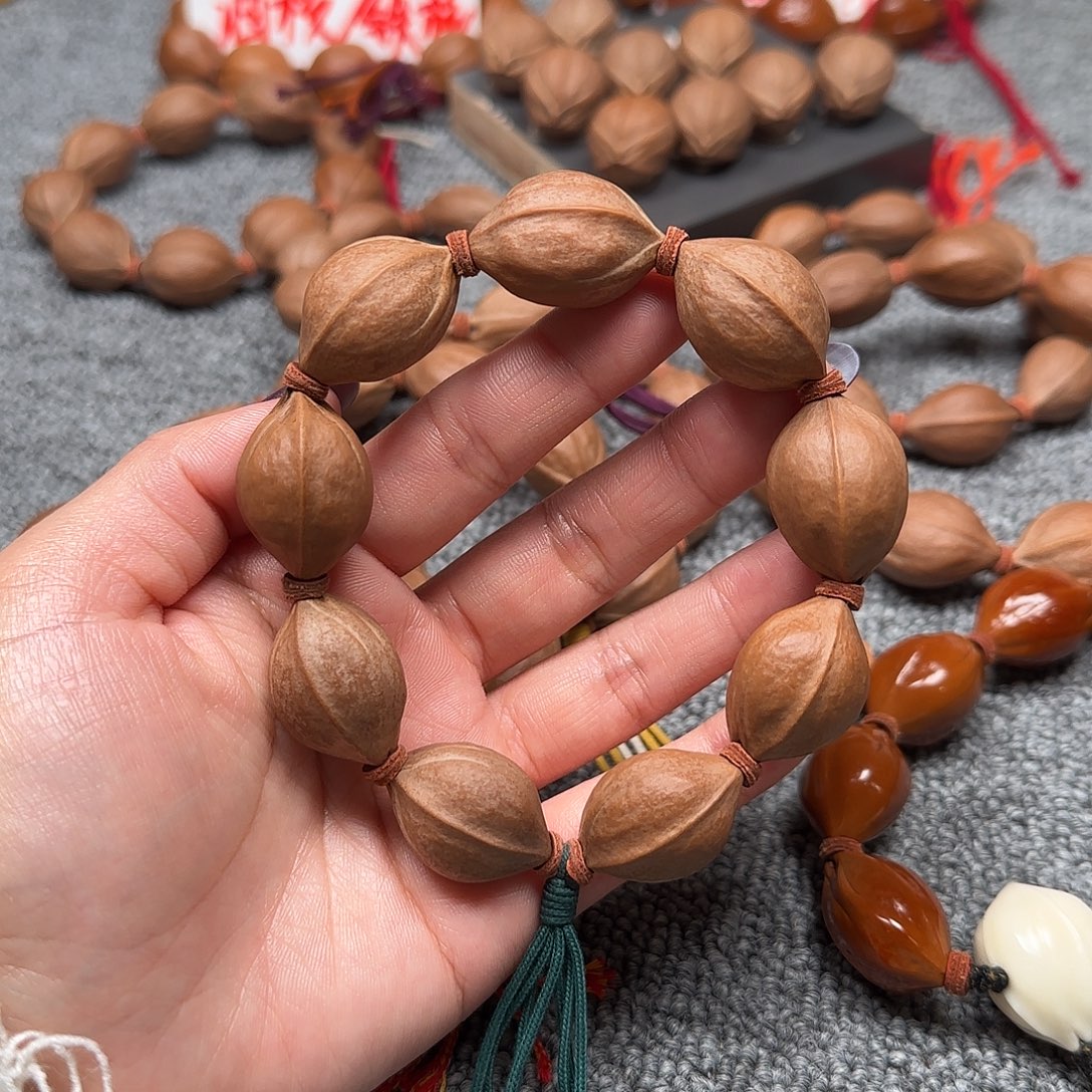 手串/手链橄榄核19*28原生态 铁核 +象牙果三通
