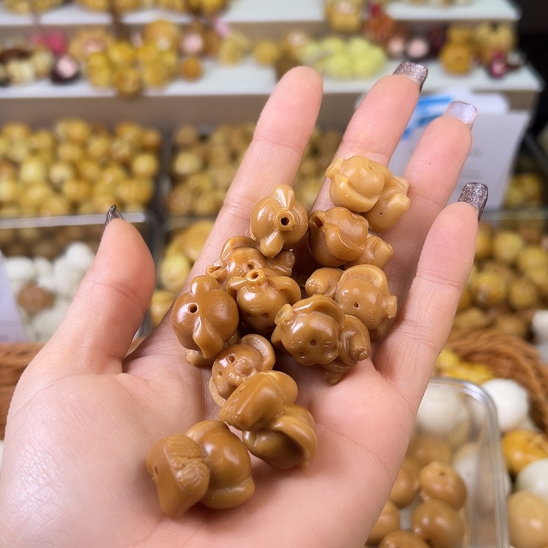 菩提根/象牙果吊坠瑕疵咖天使小象5颗表面孔道有裂