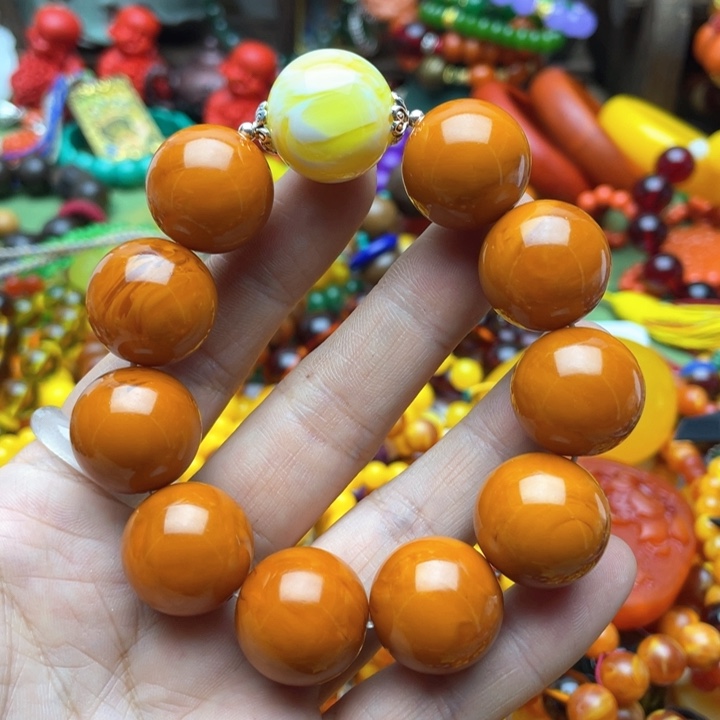 树脂制品伊****庄91号橘色手串