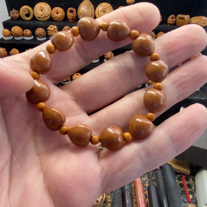 铂***)纯手工定制桃核手串12颗