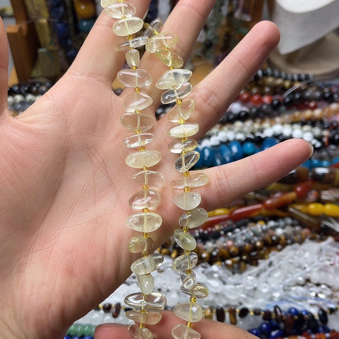 玛瑙/玉髓未镶嵌珠宝半成品柠檬晶中孔长牙一条