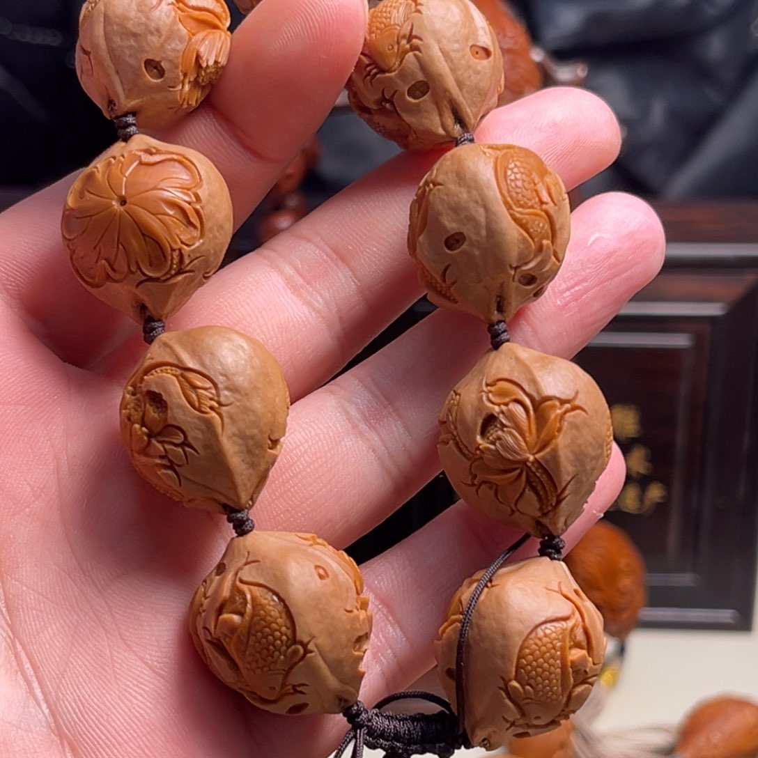 橄榄核吊坠K**l双鱼戏莲