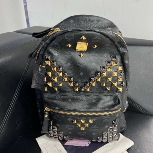 99新 MCM 捐金沉珠/铆钉双肩包