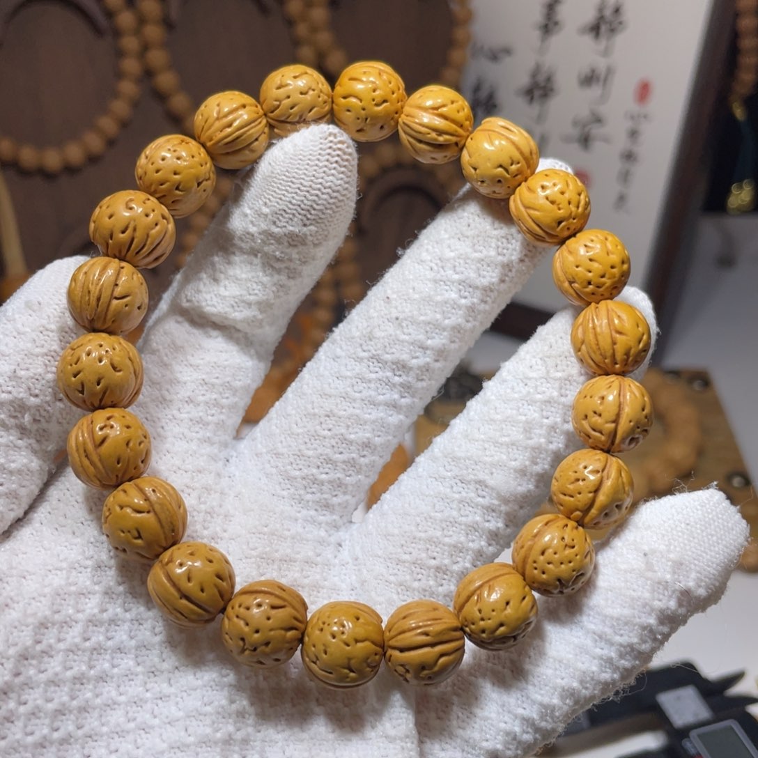 昊***昊桃核手串盘锦黄桃