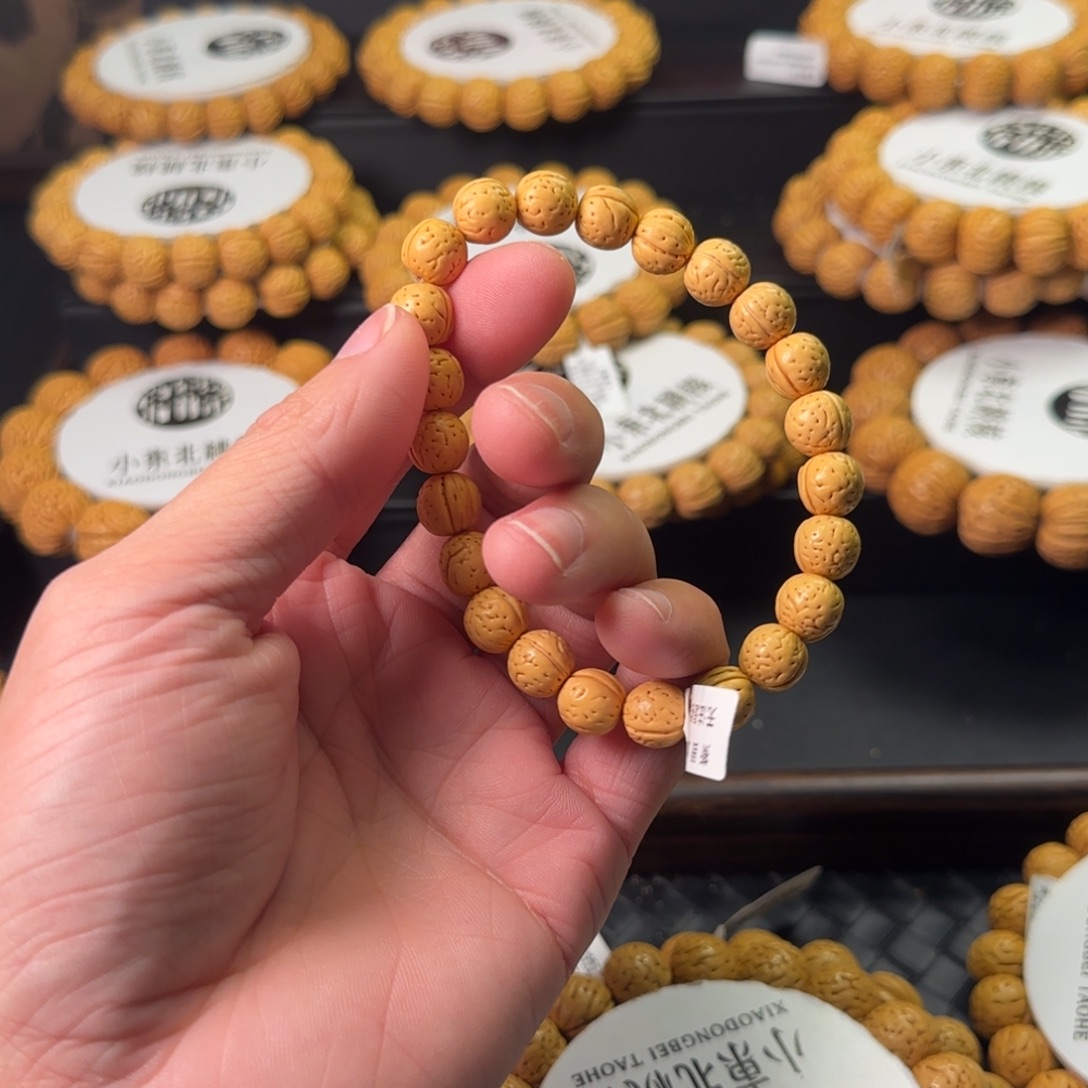****姜手串桃核精品盘锦金豆