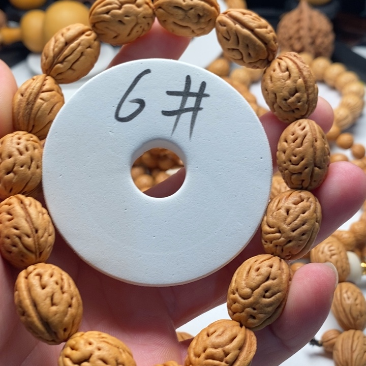 姜***期吊坠桃核桃核手持钱袋子