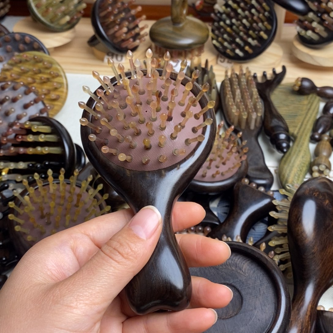 紫光檀按摩梳头发