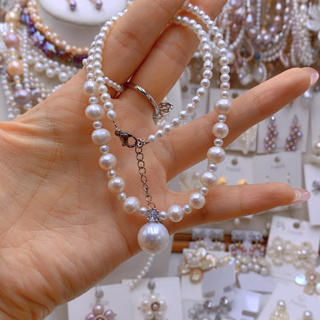 银S925镶嵌耳饰淡水珍珠-**°