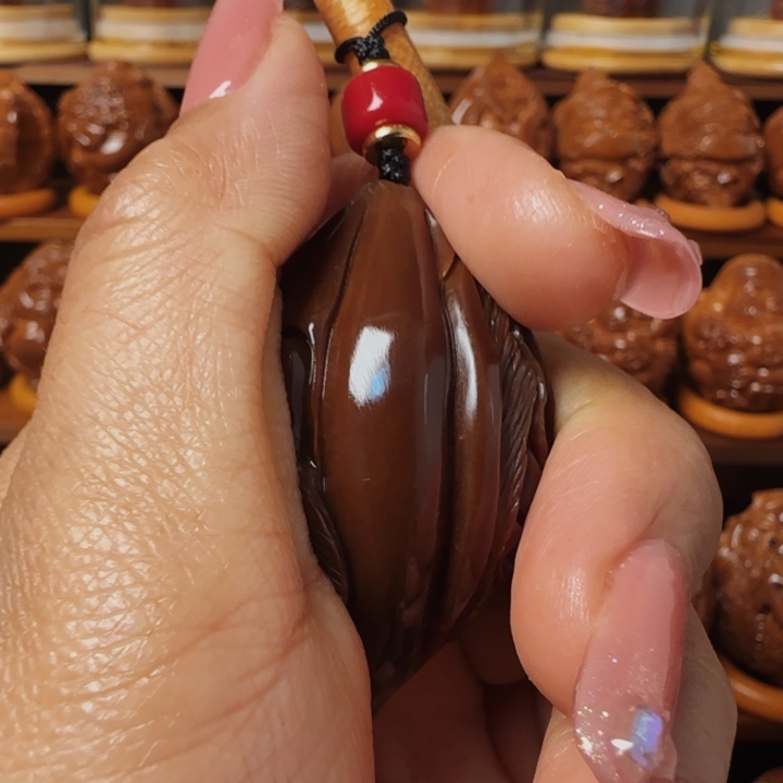 橄榄核把件玉华四面手把件