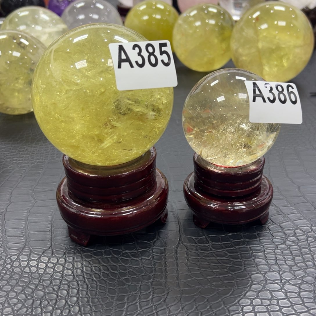 金***作石材天然黄水晶球10.0和7.06