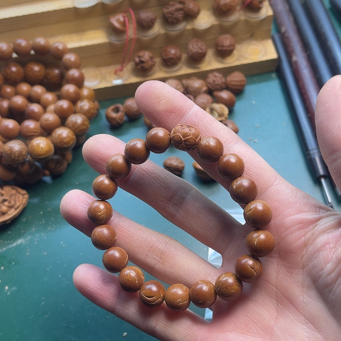 三****务桃核光珠手串1.0配莲花