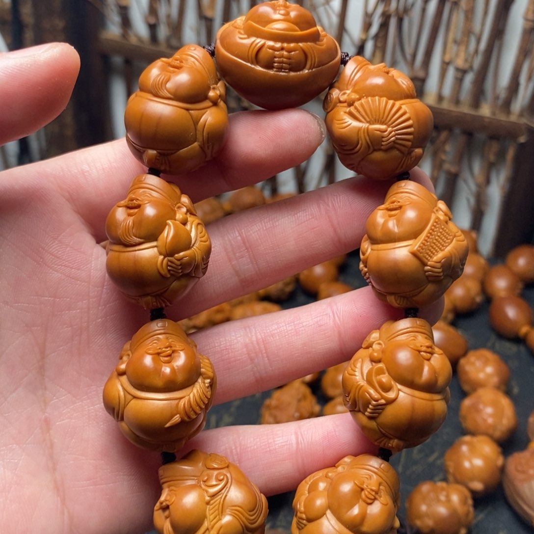 橄榄核手串老****子财神