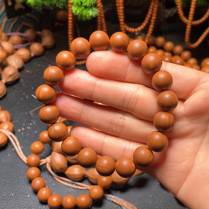 橄榄核手串里*西1.15红料光珠