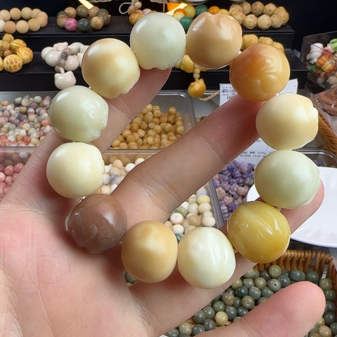 菩提根/象牙果手串微瑕疵卡18机器猫手串一条