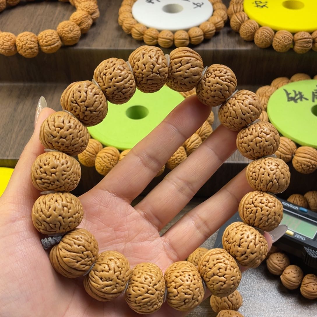 桃核手串静**晨宽脐磨盘