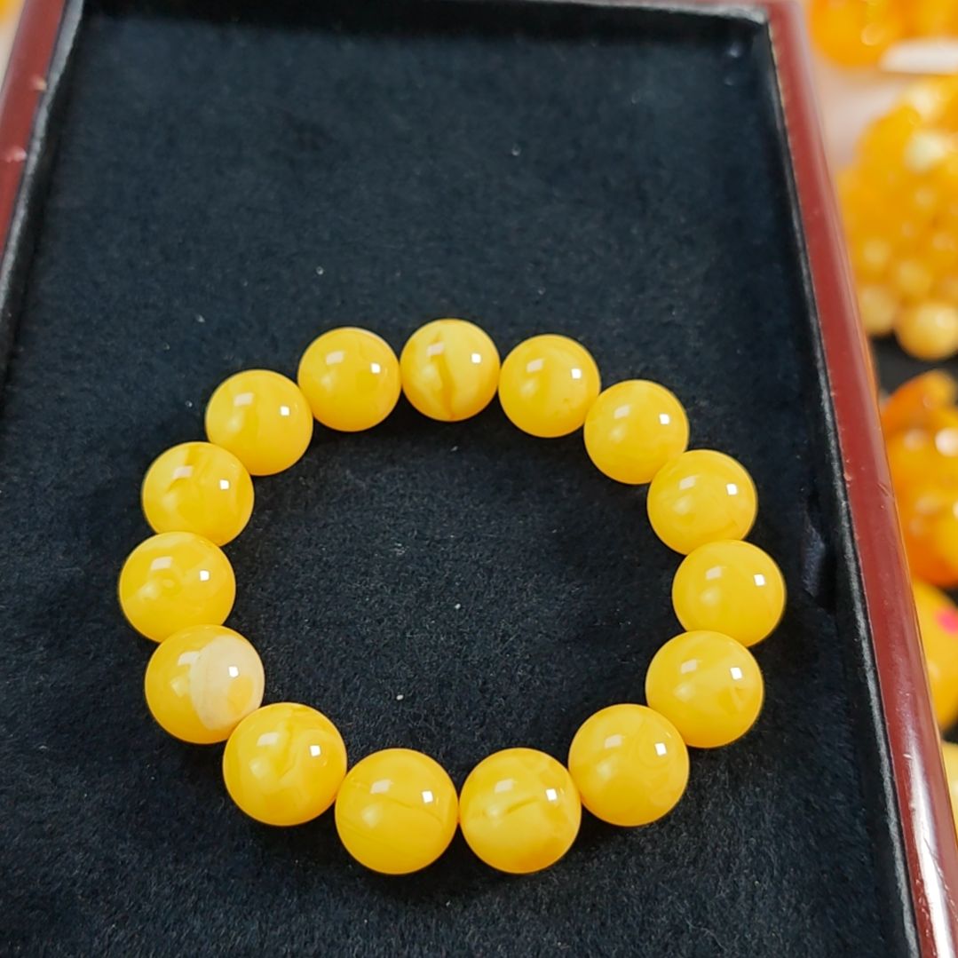 手串蜜蜡未镶嵌同料手串14m。