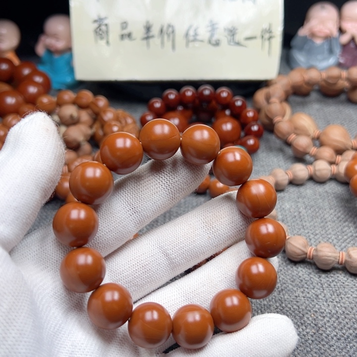 桦***心手串橄榄核1.5精品小孔