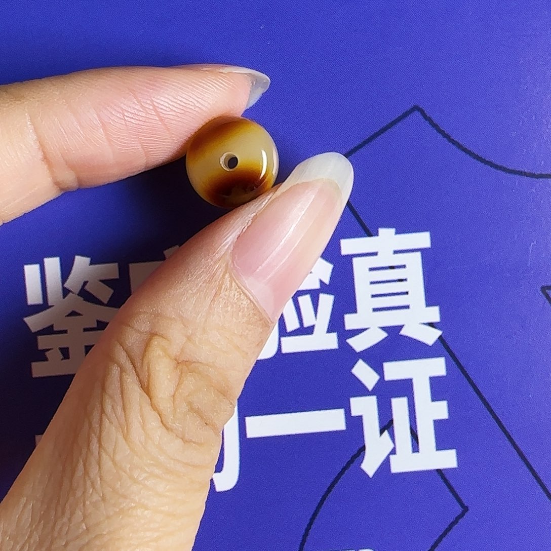 吉***哥未镶嵌琥珀裸石沁色蜜蜡单珠10mm