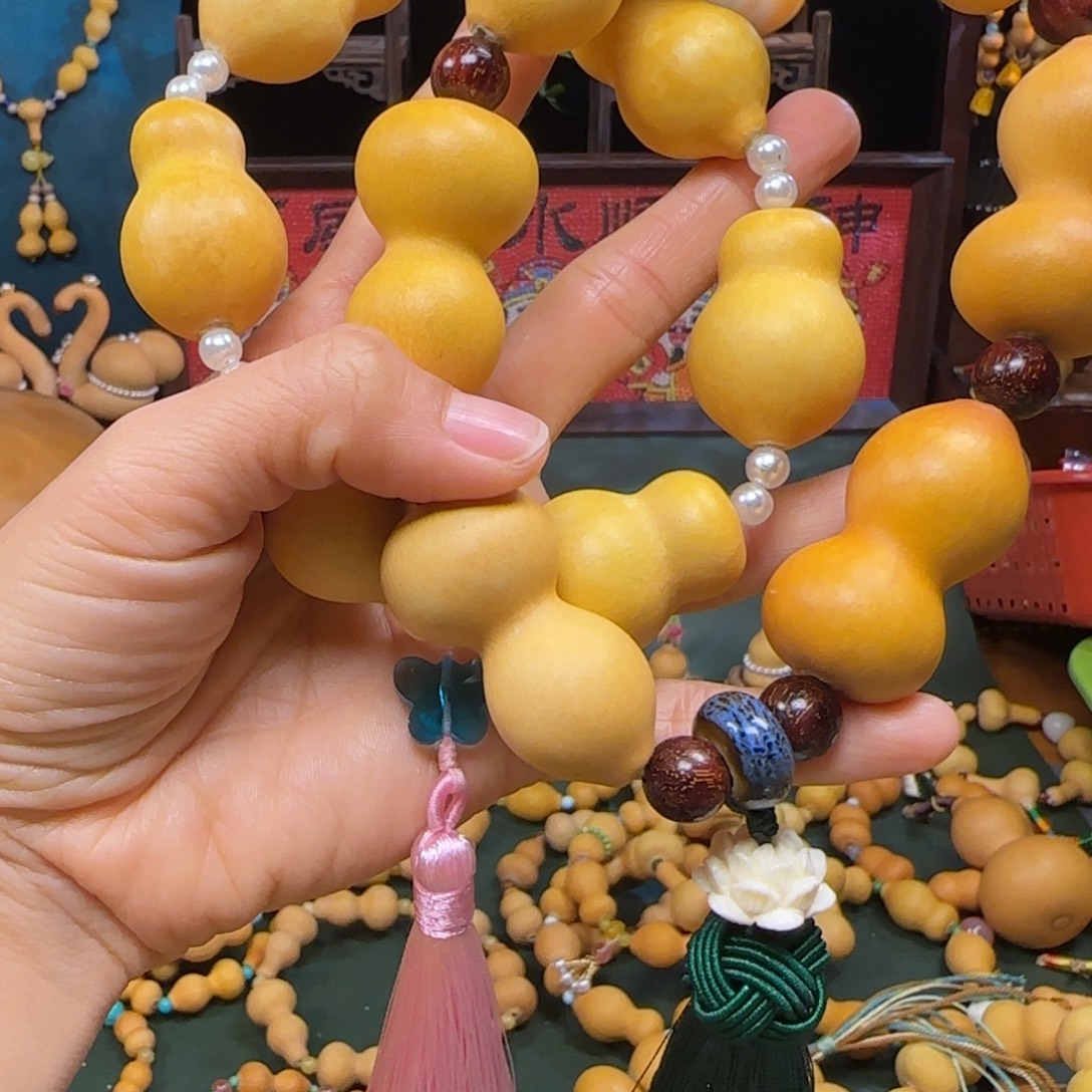 两串草里金葫芦手持