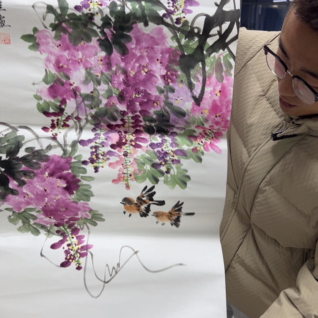 国画卖字画的小男孩