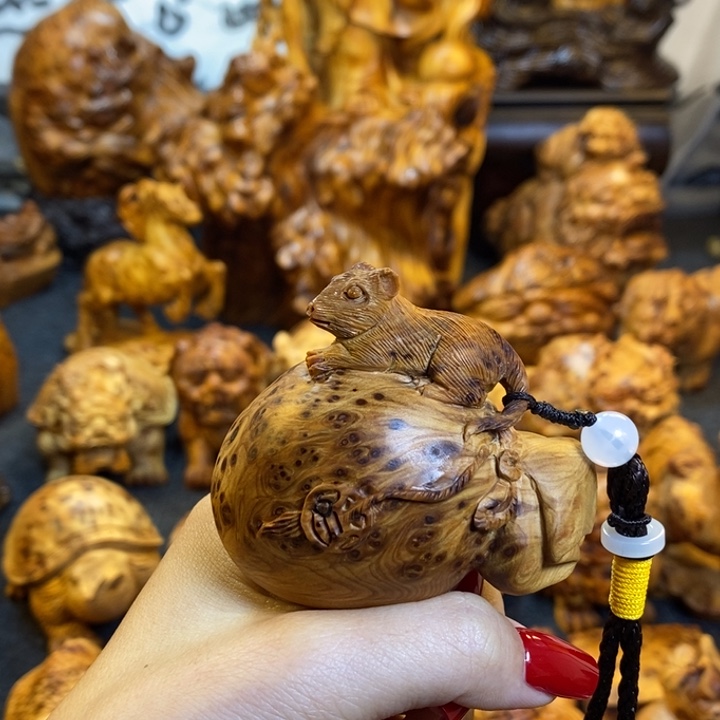 宇***华崖柏代代有钱手把件手把件