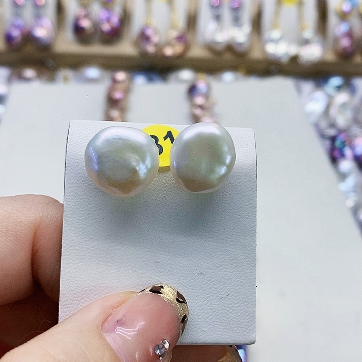 银S925镶嵌耳饰淡水珍珠T****a