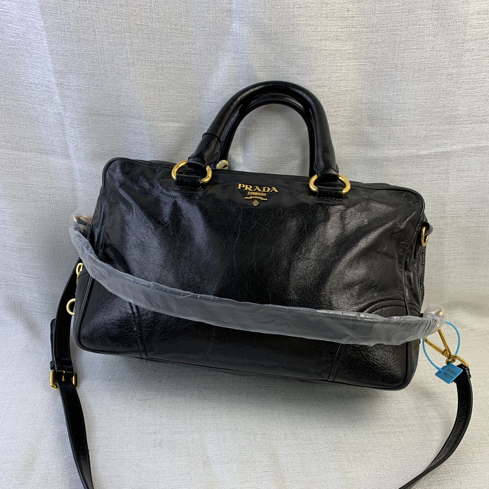95新 Prada/普拉达 黑金手提机车包/EE09730502/0502/护