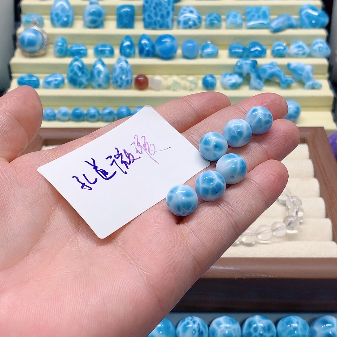 桔***子针钠钙石（海纹石）未镶嵌手链微瑕孔道