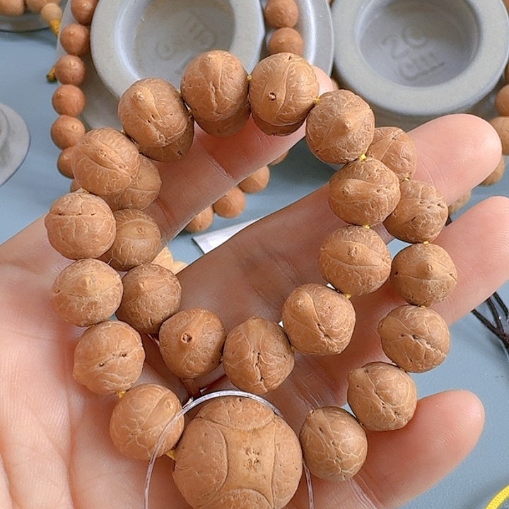 凤眼菩提把件10.5mm手持85@WF105156