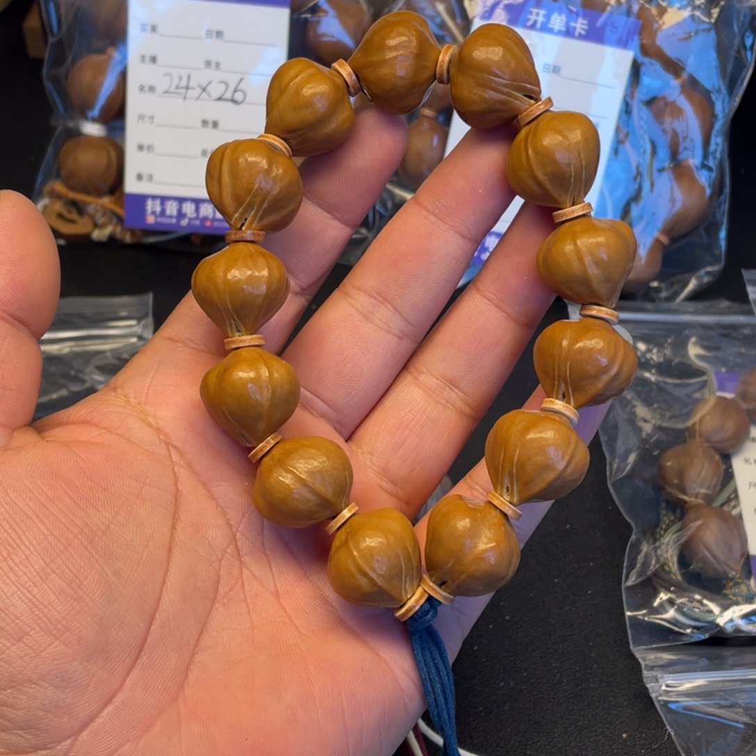 哈***酒橄榄核手串蜜桃臀21mm