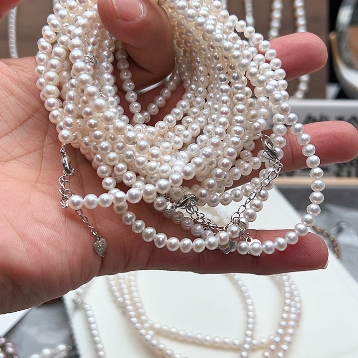 芋***泥淡水珍珠钛钢颈饰