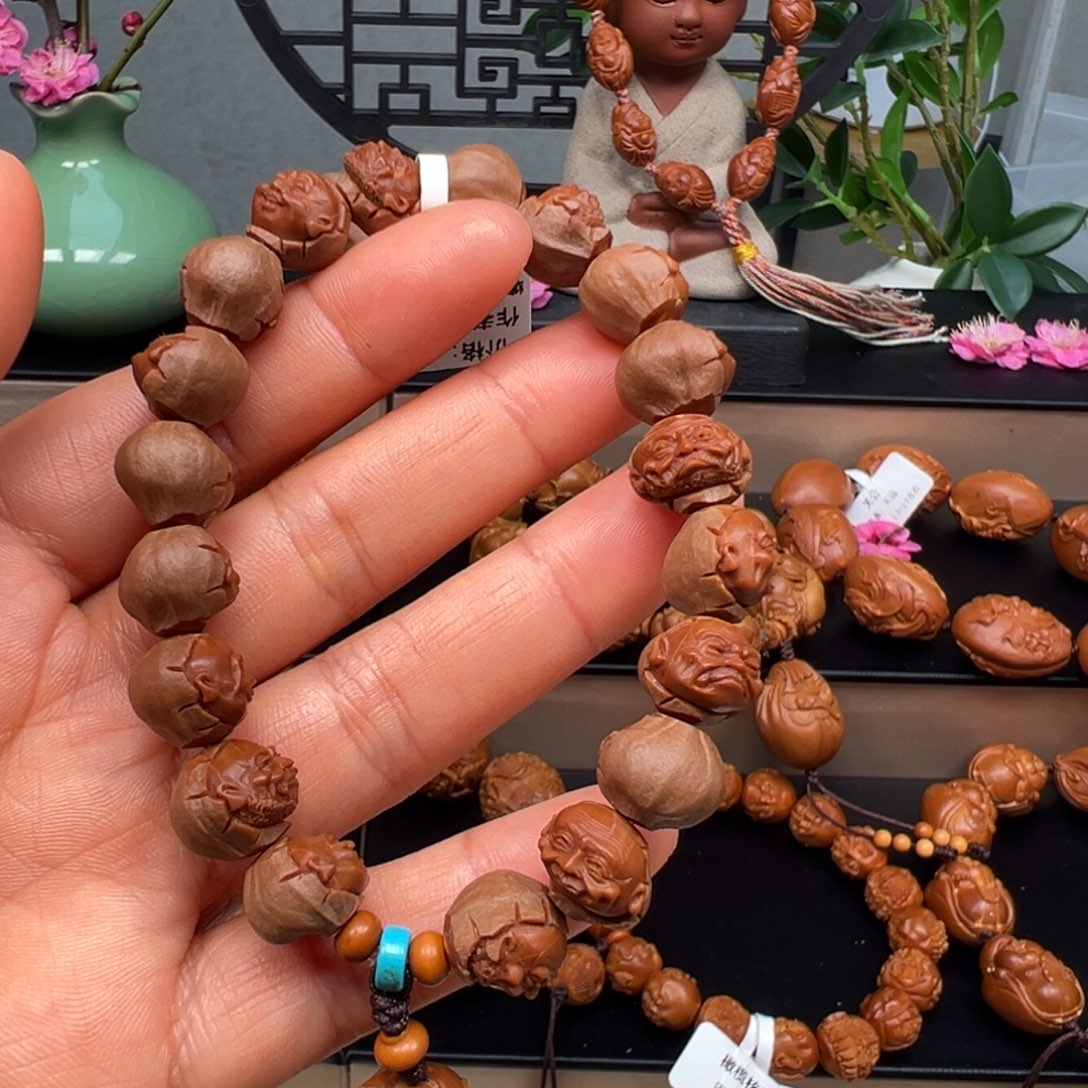 橄榄核吊坠罗汉手串