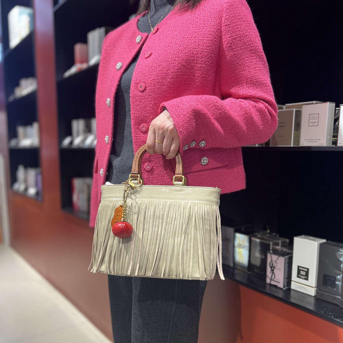 食草堂实体专柜时尚流苏包