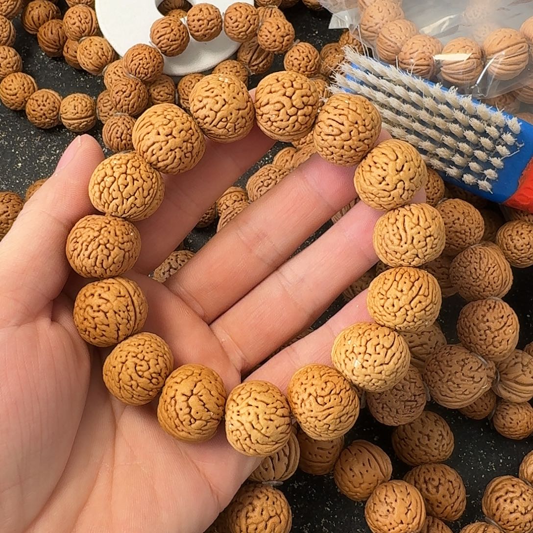 小***峰桃核吊坠野生肌肉手串