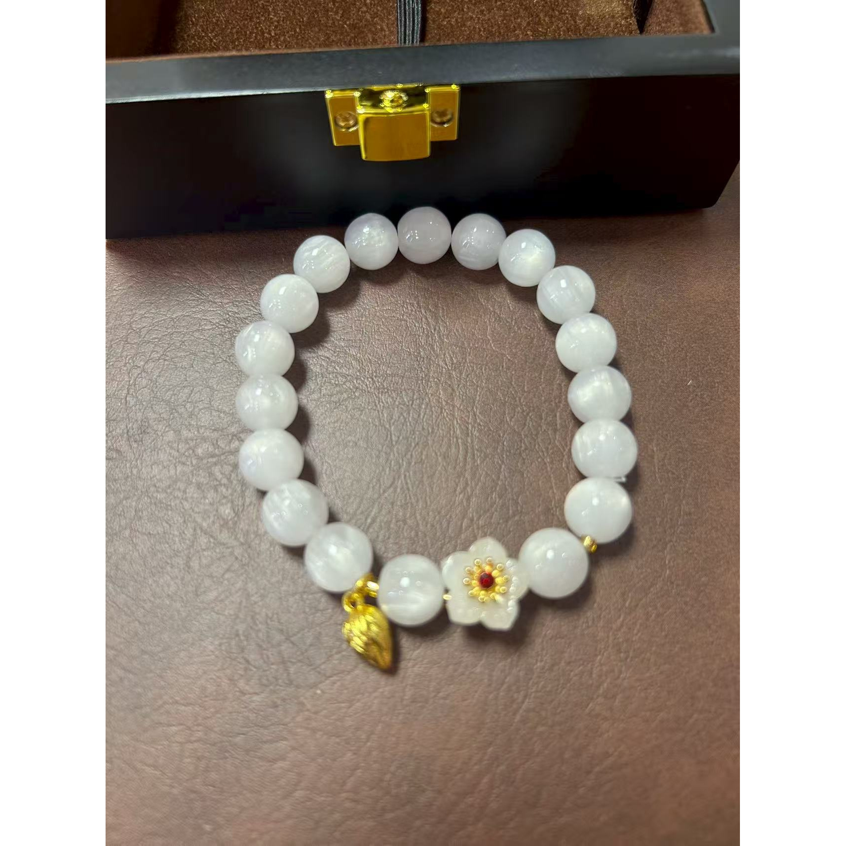 S1072-1.0樱花粉变色海云母单圈 +白桃花隔珠