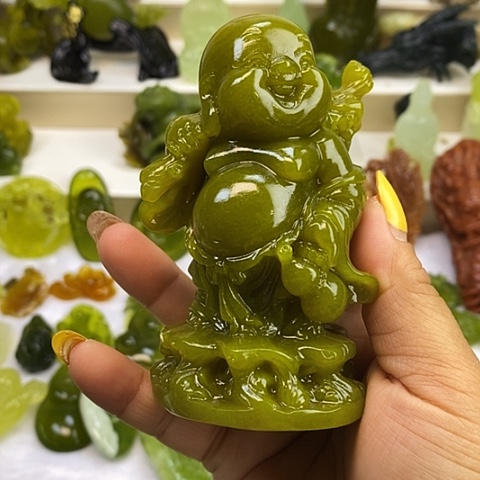 蛇纹石玉未镶嵌手把件与**行