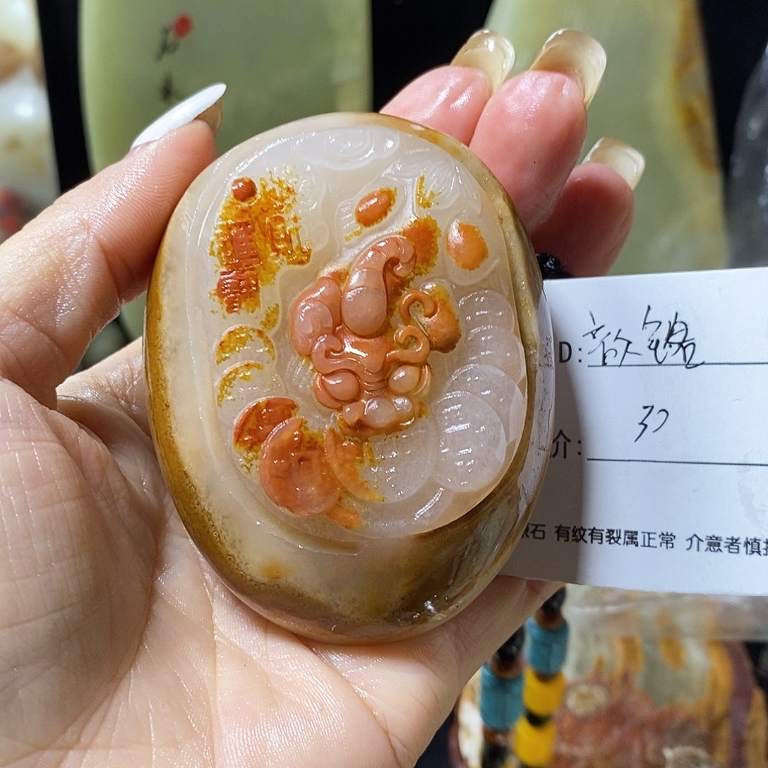 石材歆****司古青石手把件