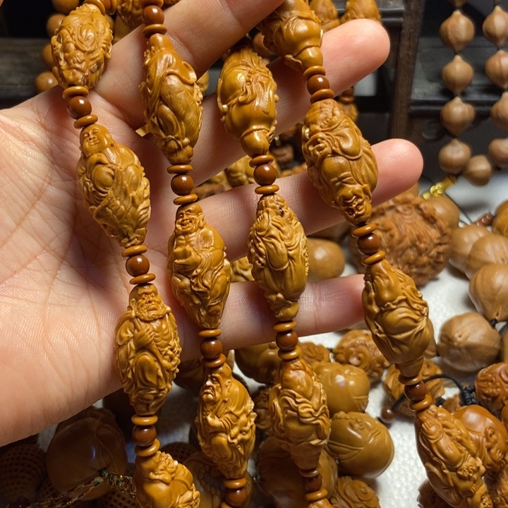 【闪购商品】橄榄核手串/手链风***。骑兽罗汉脖挂