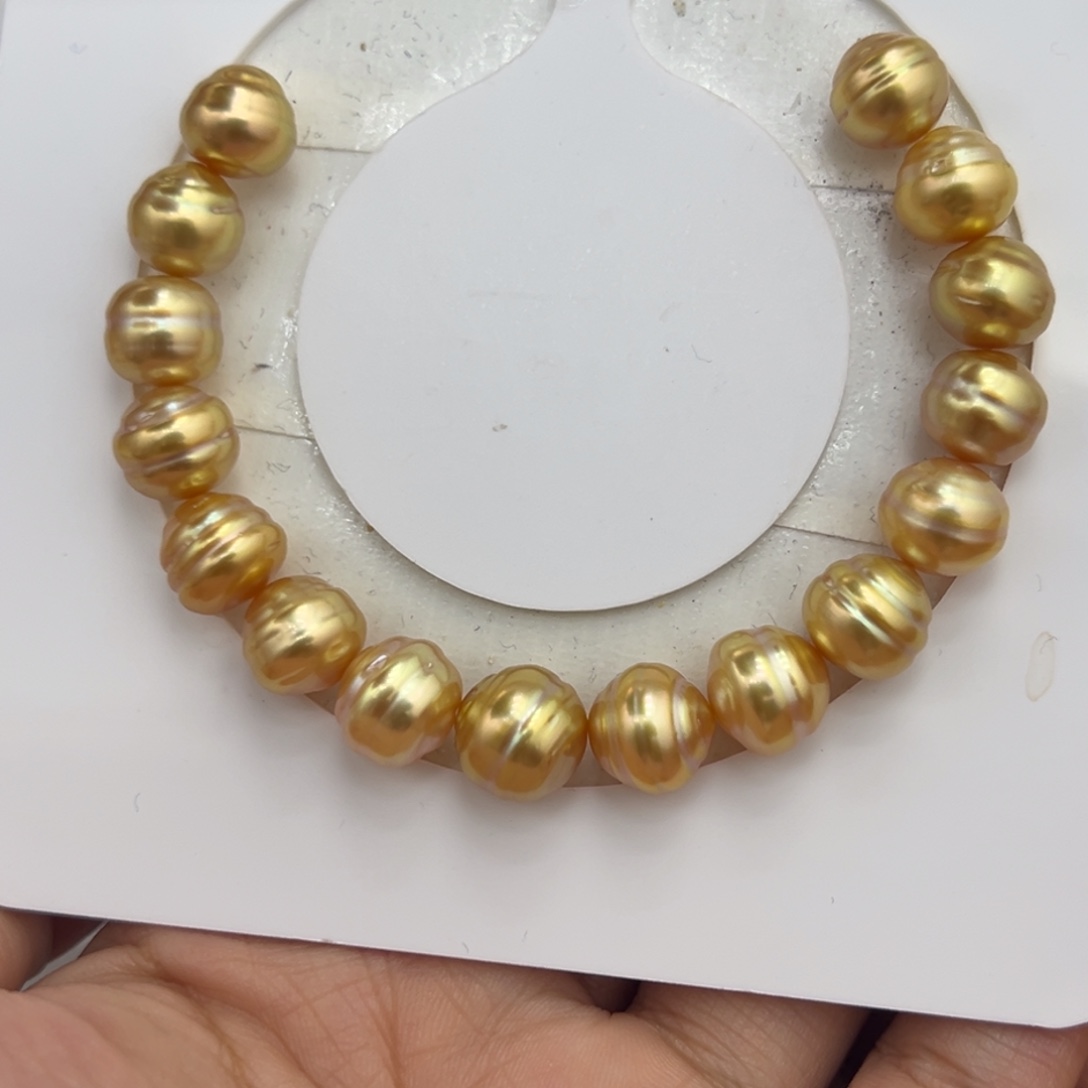 未镶嵌海水珍珠9-10.5mm浓金密螺手串